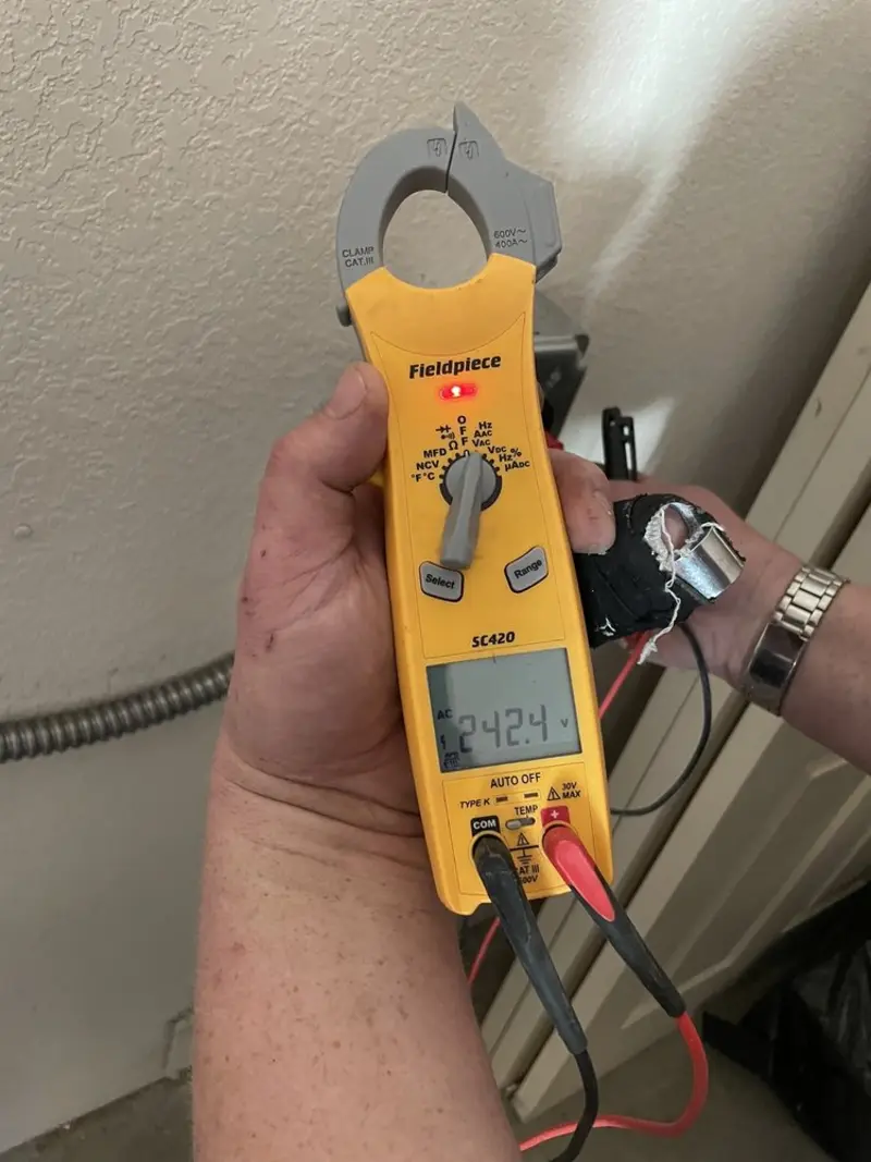 Voltage testing with clamp meter during Electrical Installation Services in Speedway
